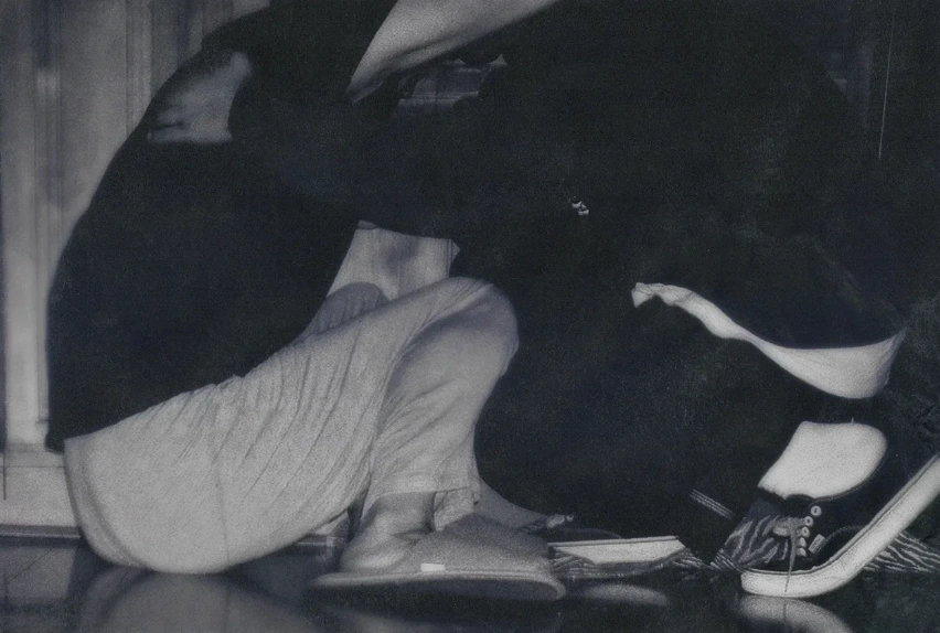 Artwork from Sweet Boy showing a boy crouched at home